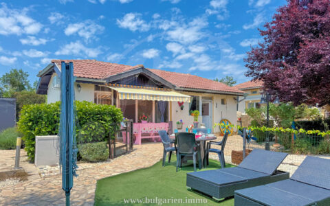 Spacious coastal property with two houses, pool, bar, and landscaped garden